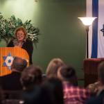 Barbara Sheinberg speaks about growing up in Pittsburghs Squirrel Hill neighborhood a couple blocks away from the Tree of Life synagogue where 11 people were killed by a gunman on Saturday. An overflowing crowd gathered at Temple Sukkat Shalom on Tuesday, Oct. 30, 2018, to honor the memory of the people killed. (Michael Penn | Juneau Empire)
