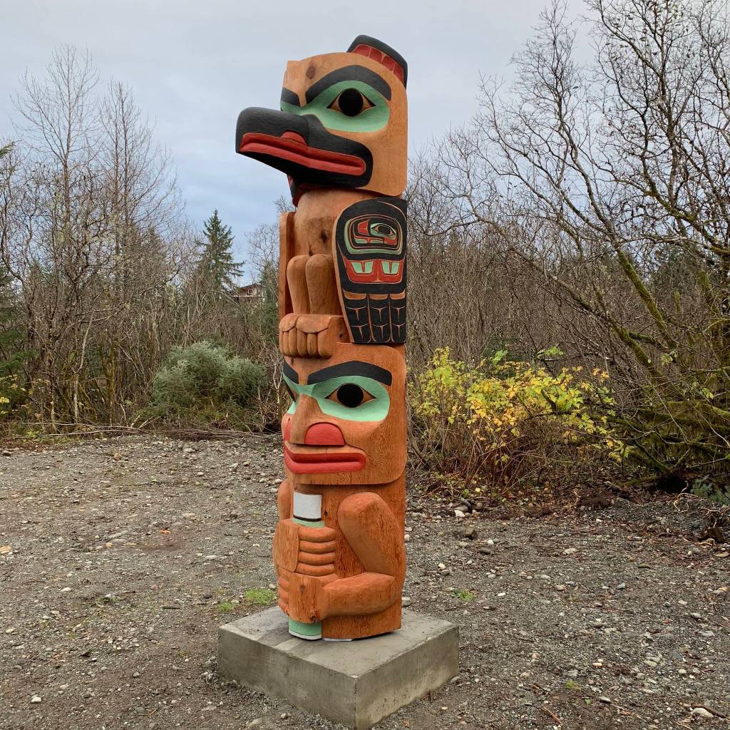 A totem pole called Yaa Khaa Kootéeyaa carved and painted by Alison Marks was raised in Yakutat. Marks may be the first Tlingit woman to carve a totem pole. The piece was named for Marks grandfather, and he is depicted holding a thermos of coffee at the bottom of the pole. (Courtesy Photo | Alison Marks)