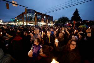 People hold candles as they gather for a vigil in the aftermath of a deadly shooting at the Tree of Life Congregation, in the Squirrel Hill neighborhood of Pittsburgh, Saturday, Oct. 27, 2018. (AP Photo/Matt Rourke)