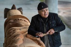 Master Tlingit carver Wayne Price making healing totem for AWARE