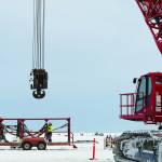A crane stands by for module and facility installation on the ConocoPhillips GMT-1 drilling pad. First oil from the project flowed on Oct. 5, and royalty revenue from the project could mean hundreds of millions in new funding for affected North Slope communities. (Courtesy Photo | Judy Patrick, ConocoPhillips)