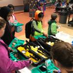 Harborview Elementary School students load up on fruit at a free school breakfast on Friday, Oct. 5, 2018. (Kevin Gullufsen | Juneau Empire File)