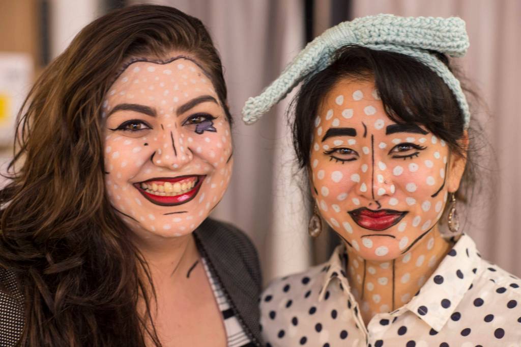 Kindred Posts Kristen Cornell, left, and Rebecca Hsieh pose for a portrait on Wednesday, Oct. 31, 2018. For the fourth year Kindred Post has organized the Halloween celebration for trick-or-treaters. (Michael Penn | Juneau Empire)