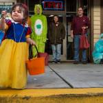 Ryelynn Wilhite examines a pencil she receives for Halloween from the employees of Front Street Clinic on Wednesday, Oct. 31, 2018. For the fourth year Kindred Post has organized the Halloween celebration for trick-or-treaters. (Michael Penn | Juneau Empire)