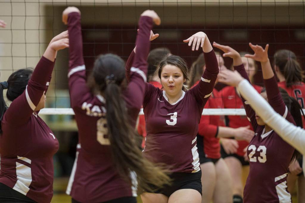 Ketchikans Autumn Yeisley (3) celebrates her successful block with her teammates as they play Juneau-Douglas High School in the first round of the Region V Volleyball Championships at JDHS on Friday, Nov. 2, 2018. JDHS won 3-0 (25-13, 25-16, 25-16). (Michael Penn | Juneau Empire)