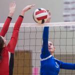Thunder Mountains Lily Smith, right, tips the ball over against Juneau-Douglas Jenae Pusich during the second round of the Region V Volleyball Championships at JDHS on Friday, Nov. 2, 2018. TMHS won 3-1 (25-20, 25-10, 16-25, 25-21). (Michael Penn | Juneau Empire)
