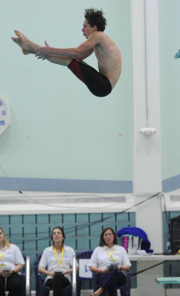 Juneau-Douglas High School senior Cian Hart competes in the 1-meter diving competition at the ASAA/First National Bank Alaska State Swim and Dive Championships on Saturday, Nov. 3, 2018. Hart finished in eighth place with a score of 343.00. (Michael Dinneen | For the Juneau Empire)