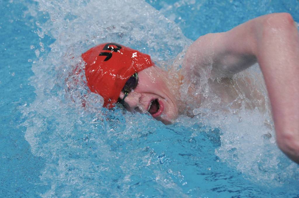 Juneau-Douglas High School junior Isaac Gabel swims in the 200-yard freestyle relay. The team finished in seventh place with a time of 1:38.66. (Michael Dinneen | For the Juneau Empire)