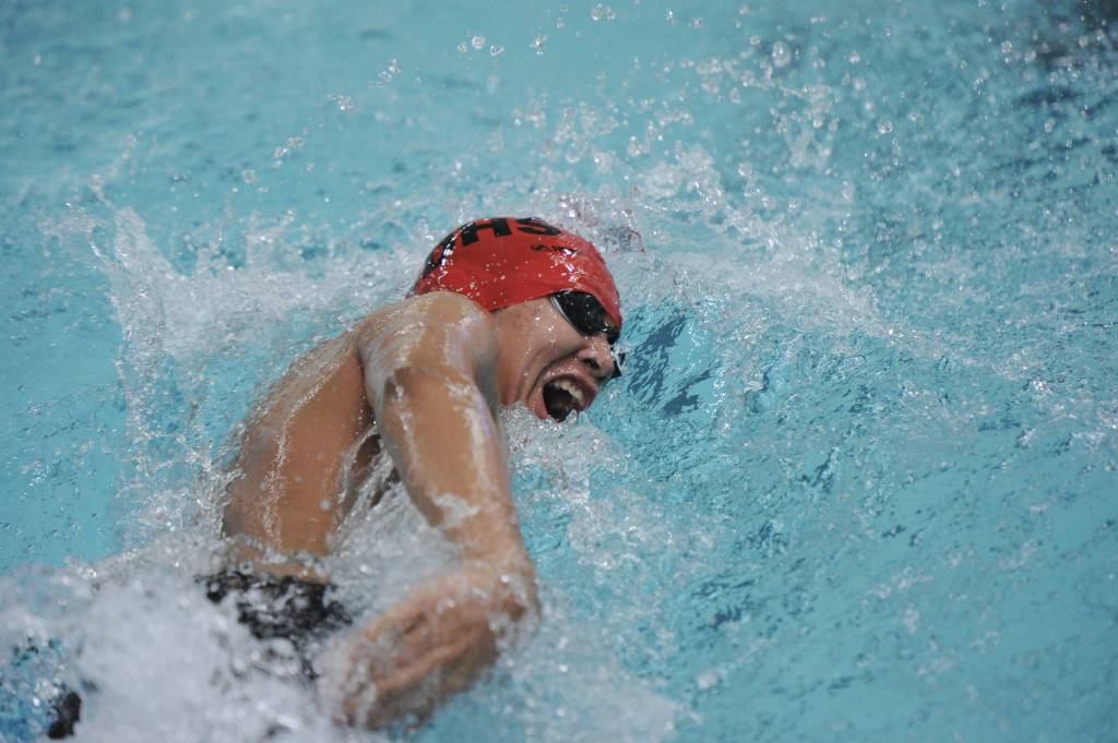 Juneau-Douglas High School junior Erik Jim swims in the 200-yard freestyle relay. (Michael Dinneen | For the Juneau Empire)