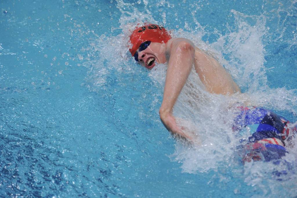 Juneau-Douglas High School senior Reed Gardinier swims in the 200-yard freestyle relay. The team finished in seventh place with a time of 1:38.66. (Michael Dinneen | For the Juneau Empire)