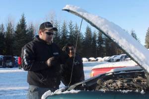 Cody Wilkie, left, and Robert Beltz examine a Ford Ranger at the open viewing of the Juneau Police Departments impounded vehicles on Wednesday, Nov. 15, 2017. (Alex McCarthy | Juneau Empire File)
