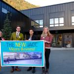 Juneau Arts & Humanities Council Executive Director Nancy DeCherney, Jeremy Bauer and Jason Clifton of Bauer/Clifton Interiors and fundraising assistant manager for the New JACC Rachelle Bonnet stand with a New JACC banner. Bauer and Clifton are the latest major donors to the proposed project. (Courtest Photo | For the JAHC)