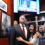 Republican gubernatorial candidate Mike Dunleavy reacts to early favorable election returns Tuesday, Nov. 6, 2018 In Anchorage, Alaska. With Dunleavy are from left, his wife Rose and daughters Ceil and Maggie. (AP Photo/Michael Dinneen)