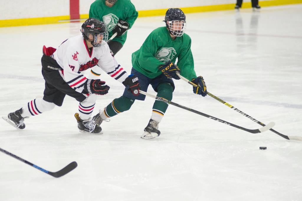 Juneau-Douglas High School senior Bill Bosse applies pressure to a Colony player during the Palmer Showdown Tournament on Thursday at the MTA Events Center in Palmer. The Knights won 3-1. JDHS plays reigning Division I state champion Dimond on Friday. (Nolin Ainsworth | Juneau Empire)