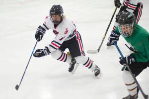 Juneau-Douglas junior Ethan Welch skates after the puck during the Palmer Showdown Tournament on Thursday at the MTA Events Center in Palmer. The Knights won 3-1. JDHS plays reigning Division I state champion Dimond on Friday. Soldotna, West Anchorage, Homer, Dimond, Wasilla and Palmer are also participating in the three-day tournament. (Nolin Ainsworth | Juneau Empire)