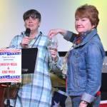 League of Women Voters of Juneau Director Judith Mitchell and Vice President Marianne Mills draw a door prize during the Leagues fourth annual Wine Tasting and Silent Auction Fundraiser on Oct. 5, 2018, at the Hangar Ballroom. (Courtesy Photo | Kim Andree Jones)