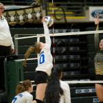 Thunder Mountain High School senior Audrey Welling spikes the ball as South Anchorages Hope Todd goes up for the block at the ASAA/First National Bank Alaska 3A/4A Volleyball State Championships on Friday at the Alaska Airlines Center in Anchorage. South Anchorage won 3-0 (25-10, 25-21, 25-12). (Nolin Ainsworth | Juneau Empire)