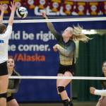 South Anchorage High School senior Erin Doner spikes the ball toward Thunder Mountains Sophia Harvey in the ASAA/First National Bank Alaska 3A/4A Volleyball State Championships on Friday at the Alaska Airlines Center in Anchorage. South won 3-0 (25-10, 25-21, 25-12). (Nolin Ainsworth | Juneau Empire)