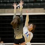 Thunder Mountain High School junior Tasi Fenumiai spikes the ball as South Anchorages Camryn Houser goes up for the block in the ASAA/First National Bank Alaska 3A/4A Volleyball State Championships on Friday at the Alaska Airlines Center in Anchorage. South won 3-0 (25-10, 25-21, 25-12). (Nolin Ainsworth | Juneau Empire)