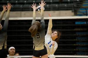 Thunder Mountain High School juniorTasi Fenumiai spikes the ball as South Anchorages Camryn Houser goes up for the block in the ASAA/First National Bank Alaska 3A/4A Volleyball State Championships on Friday at the Alaska Airlines Center in Anchorage. South won 3-0 (25-10, 25-21, 25-12). (Nolin Ainsworth | Juneau Empire)