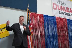 In this photo taken Sunday, Nov. 4, 2018, Alaska Republican gubernatorial candidate Mike Dunleavy gestures while on stage during a GOP rally in Anchorage, Alaska. Dunleavy and Democrat Mark Begich are the two major candidates vying to replace Gov. Bill Walker, who ended his campaign in October. (AP Photo/Becky Bohrer)
