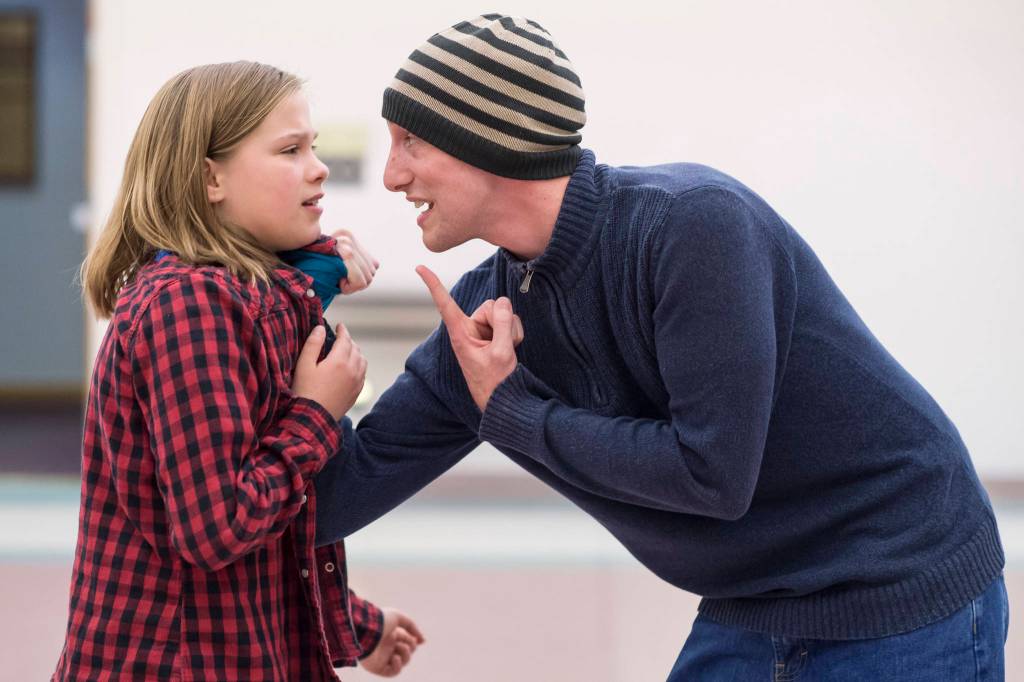Aaron Schetky, right, playing Mr. Wormwood, threatens Rachel Wood, playing Matilda, during rehearsal of Theater at Latitude 58s production of Matilda at St. Anns Parish Hall on Friday, Nov. 9, 2018. (Michael Penn | Capital City Weekly)
