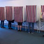 Hector Mojica exits a voting booth at Glacier Valley Baptist Church on Election Day, Tuesday, Nov. 6, 2018. (Michael Penn | Juneau Empire)