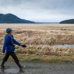 Laurie Lamm takes an exercise break on her lunch hour along the Airport Dike Trail on Thursday, Nov. 8, 2018. (Michael Penn | Juneau Empire)