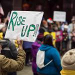 Nearly 100 people show up to protest President Donald Trumps appointment of Matthew Whitaker for U.S. Attorney General outside the Federal Building on Thursday. Many protesters believe Whitakers hiring could jeopardize the Mueller investigation into possible connections between Trumps presidential campaign and the Russian government. (Michael Penn | Juneau Empire)