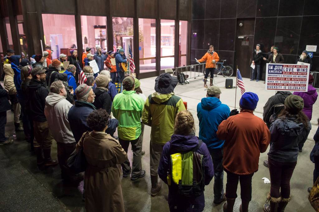 University of Alaska Southeast history professor David Noon speaks as nearly 100 people protest President Donald Trumps appointment of Matthew Whitaker outside the Hurff Ackerman Saunders Federal Building on Thursday. Many protesters believe Whitakers hiring could jeopardize the Mueller investigation into Trumps presidential campaign and the Russian government. (Michael Penn | Juneau Empire)