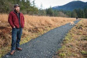 Erik Boraas, Executive Director of Trail Mix, Inc., talks about the organization while walking along the newly reworked Switzer-Marriot Aquatic Education Trail in Switzer Creek on Monday, Nov. 12, 2018. Trail Mixs annual fundraising dinner and auction is November 17 at Centennial Hall. (Michael Penn | Juneau Empire)