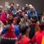 Native speakers stand to watch the Tlingit Culture Language and Literacy Dance Group from Harborview Elementary School dance during the Voices of Our Ancestors Language Summit at Centennial Hall on Tuesday, Nov. 13, 2018. (Michael Penn | Juneau Empire)
