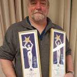 Rik Pruett is seen with his Goldies awards in Ketchikan earlier this month. (Courtesy photo)