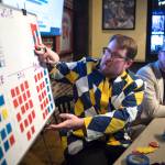 Juneau Empire reporters James Brooks, left, and Alex McCarthy keep track of Alaska legislative races from the Empires Election Central at McGivneys Sports Bar and Grill on Tuesday, Nov. 6, 2018. (Michael Penn | Juneau Empire)