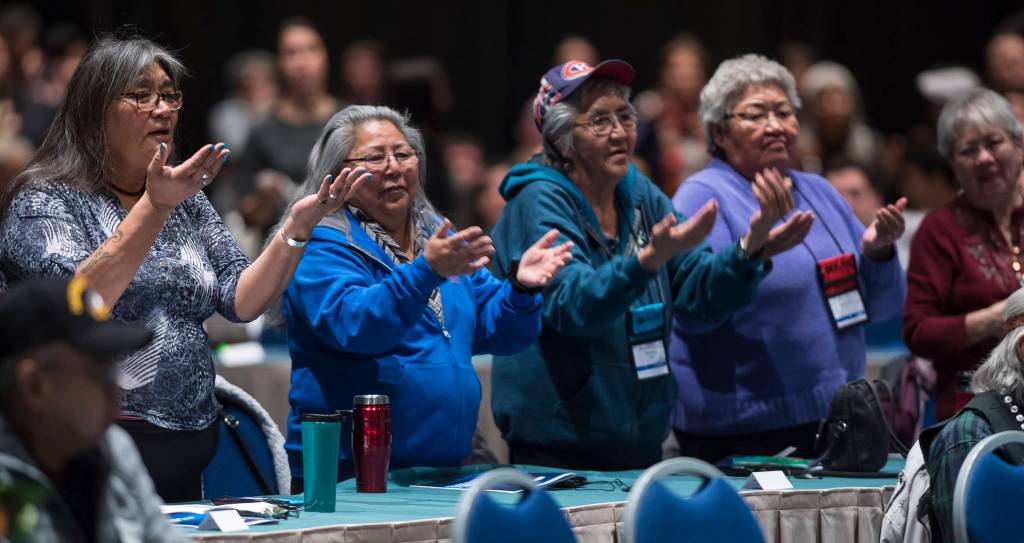 Women dance with the Tlingit Culture Language and Literacy Dance Group from Harborview Elementary School during the Voices of Our Ancestors Language Summit at Centennial Hall on Tuesday, Nov. 13, 2018. (Michael Penn | Juneau Empire)