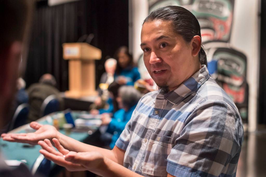 X̱ unei Lance Twitchell, Associate Professor of Alaska Native Languages Arts and Sciences at the University of Alaska Southeast, speaks about how new words are created in Native languages at the Voices of Our Ancestors Language Summit at Centennial Hall on Wednesday, Nov. 14, 2018. (Michael Penn | Juneau Empire)