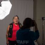 Georgina Sydney, of Teslin, Yukon, has her picture taken by Sealaska Heritage Institutes Nobu Koch at the Voices of Our Ancestors Language Summit at Centennial Hall on Wednesday, Nov. 14, 2018. (Michael Penn | Juneau Empire)