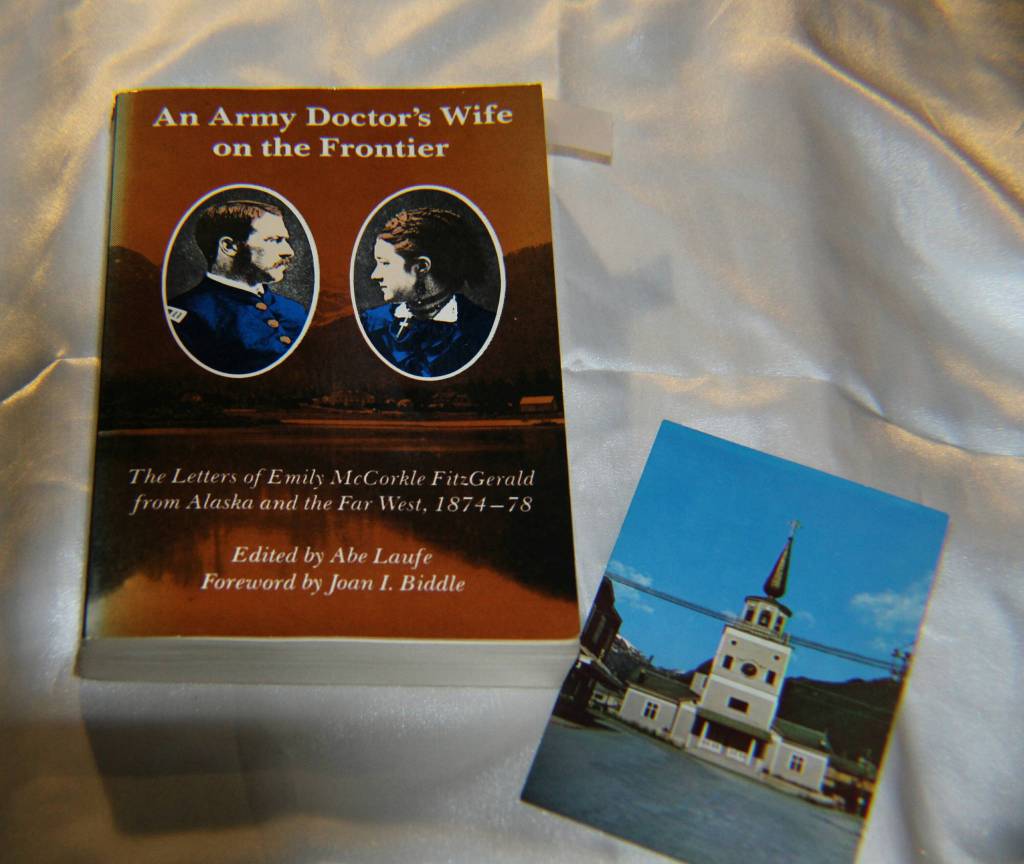 Book of letters about life in post-Russia Sitka by an Army doctors wife, and post card of the original St. Michaels Cathedral before it burned. (Courtesy Photo | Tara Neilson)