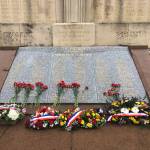 Flowers placed on the Monument aux Morts in front of the Gare de Cholet. (Bridget McTague | For the Juneau Empire)