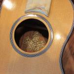 Paul Gardinier includes a hand drawn label on most of the instruments he makes. He said when you invest 40-60 hours into making a guitar or ukulele, spending another hour on a label seems insignificant. (Ben Hohenstatt | Capital City Weekly)