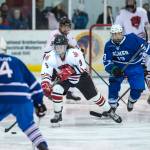 Juneau-Douglas Chance Turinsky pushes the puck up the ice between Palmers Alex Nelius, left, and Easton Armstrong on Friday, Nov. 16, 2018. (Michael Penn | Juneau Empire)