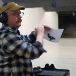 Sven Pearson takes down his target during the Thanksgiving Turkey Shoot at the Alaska Department of Fish and Game Hunter Education Facility rifle range on Saturday. The event was put on by the Juneau Gun Club, Juneau Shooting Sports Foundation, Juneau Archery Club and ADFG and awarded approximately 90 turkeys. (Nolin Ainsworth | Juneau Empire)