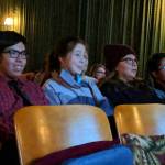 Michael Martin Jr., whose short film Adapt screened during a showing of Our Alaskan Stories watches his movie with his girlfriend, Annie Masterman; mom, Michelle Martin; and brother, Micheel Martin at Gold Town Nickelodeon Saturday, Nov. 17. (Ben Hohenstatt | Capital City Weekly)