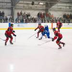 Palmers Zach Nelius is hounded by four Juneau-Douglas players in the second period of the JDHS-Palmer conference game on Saturday, Nov. 17, 2018. JDHS won 9-0. (Nolin Ainsworth | Juneau Empire)