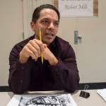 Robert Mills talks about what formline means to him at the Celebrating Our Ways of Life for Native American Heritage Month at the Elizabeth Peratrovich Hall on Friday, Nov. 16, 2018. (Michael Penn | Juneau Empire)