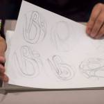 Robert Mills shows examples of formline at the Celebrating Our Ways of Life for Native American Heritage Month at the Elizabeth Peratrovich Hall on Friday, Nov. 16, 2018. (Michael Penn | Juneau Empire)