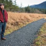 Erik Boraas, Executive Director of Trail Mix, Inc., talks about the organization while walking along the newly reworked Davis Meadows Trail in Switzer Creek on Monday, Nov. 12, 2018. Trail Mixs annual fundraising dinner and auction was Nov. 17 at Centennial Hall. (Michael Penn | Juneau Empire)
