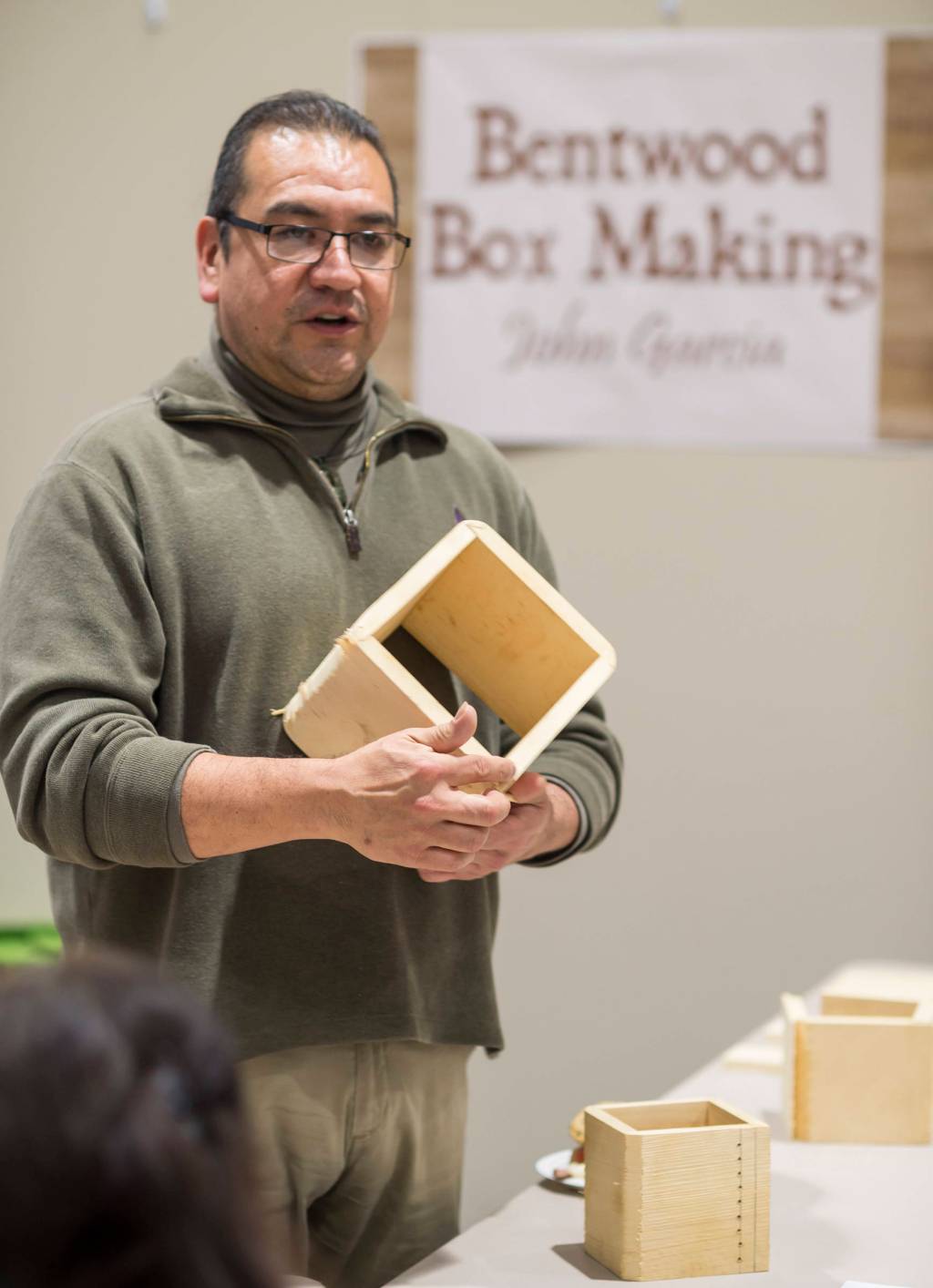 John Garcia talks about making bendwood boxes out of yellow cedar at Celebrating Our Ways of Life for Native American Heritage Month at the Elizabeth Peratrovich Hall on Friday, Nov. 16, 2018. (Michael Penn | Juneau Empire)