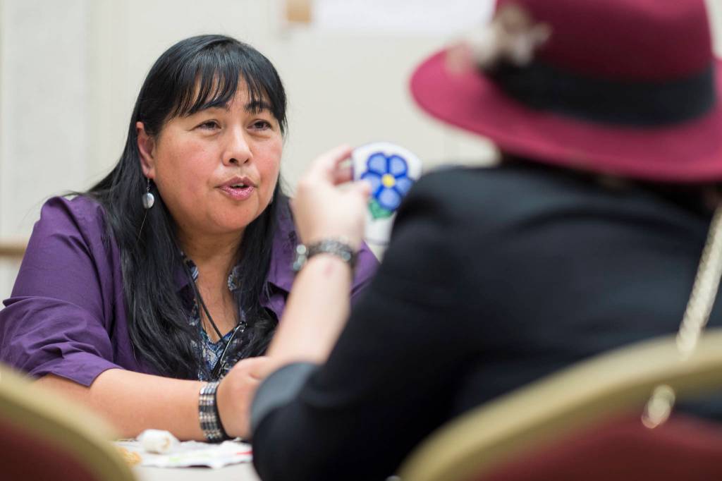 Selena Beierly, left, teaches Carley Jackson about beading at the Celebrating Our Ways of Life for Native American Heritage Month at the Elizabeth Peratrovich Hall on Friday, Nov. 16, 2018. (Michael Penn | Juneau Empire)