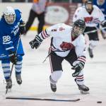 Juneau-Douglas Ronan Lynch is stripped of his stick against Palmers Darian Wilson on Friday, Nov. 16, 2018. (Michael Penn | Juneau Empire